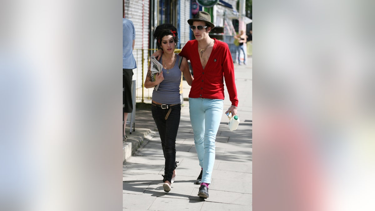 Amy Winehouse walking with Blake Fielder-Civil