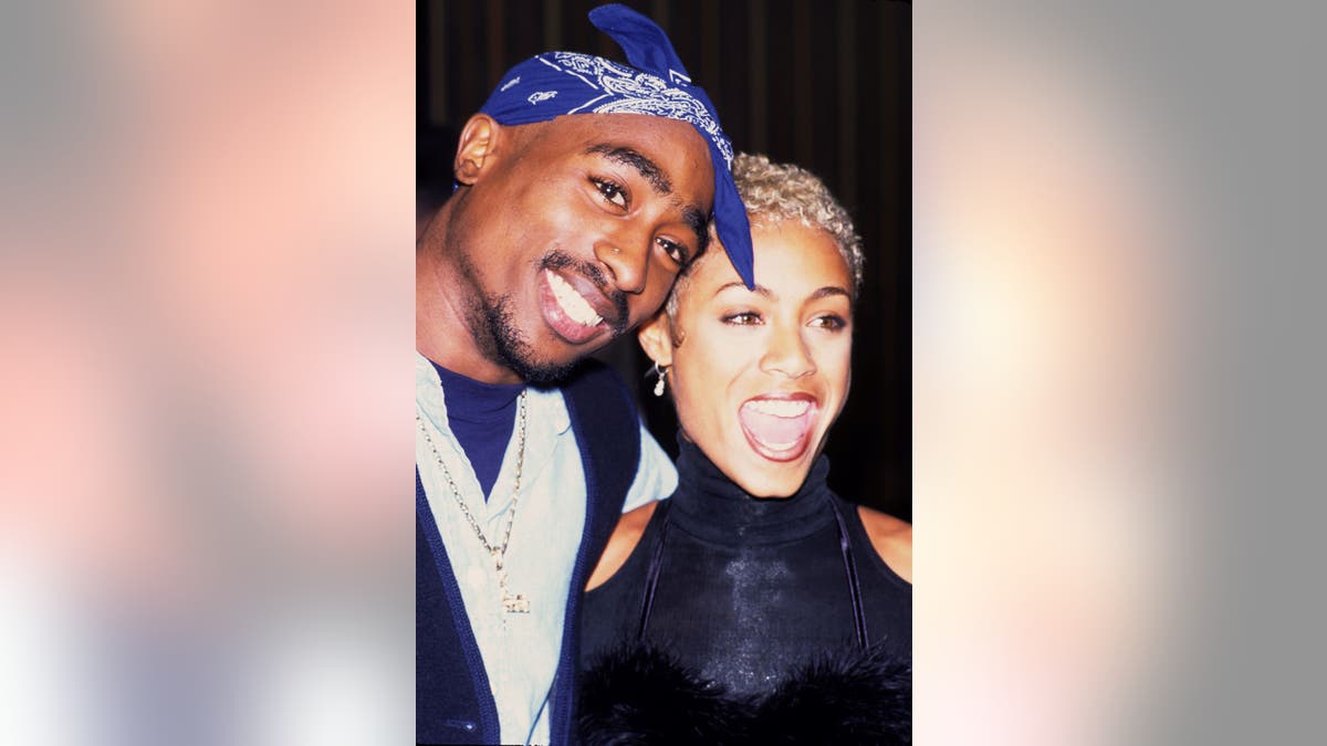 Close up of Tupac Shakur and Jada Pinkett Smith smiling