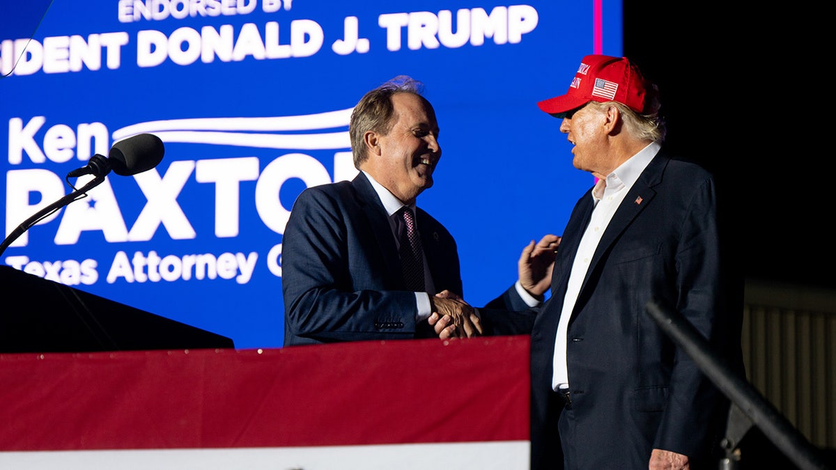 Ken Paxton shakes hands with President Trump