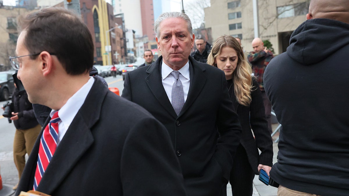 Former FBI agent Charles McGonigal walks outside courthouse