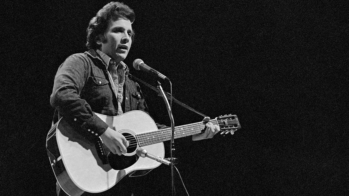 young Don McLean with guitar