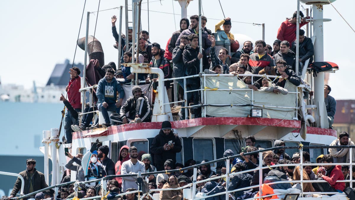 Migrants aboard a boat