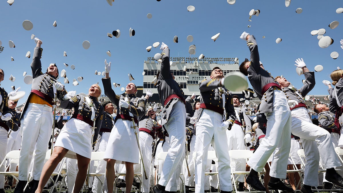 West Point grads throw caps