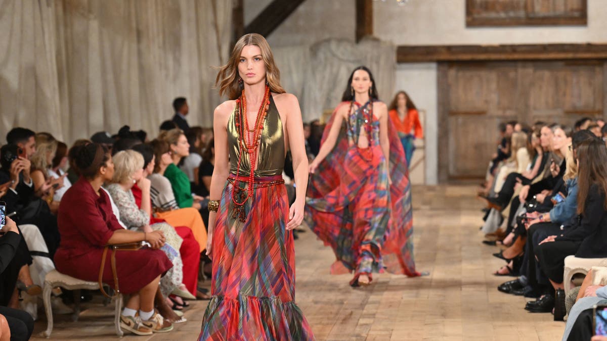 Models walk down the runway at the Ralph Lauren Spring Summer 2024 show in the Brooklyn Navy Yard
