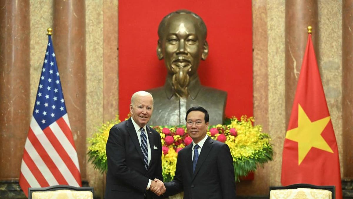 Vietnamese President Vo Van Thuong and President Biden shake hands during a meeting at the Presidential Palace in Hanoi, Vietnam, on Sept. 11, 2023.