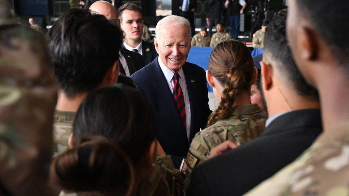 President Joe Biden greets service members