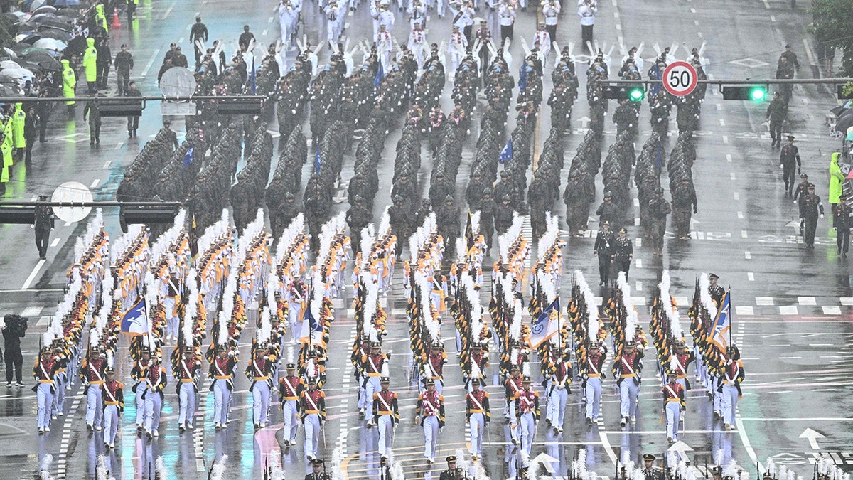 Military personnel marching