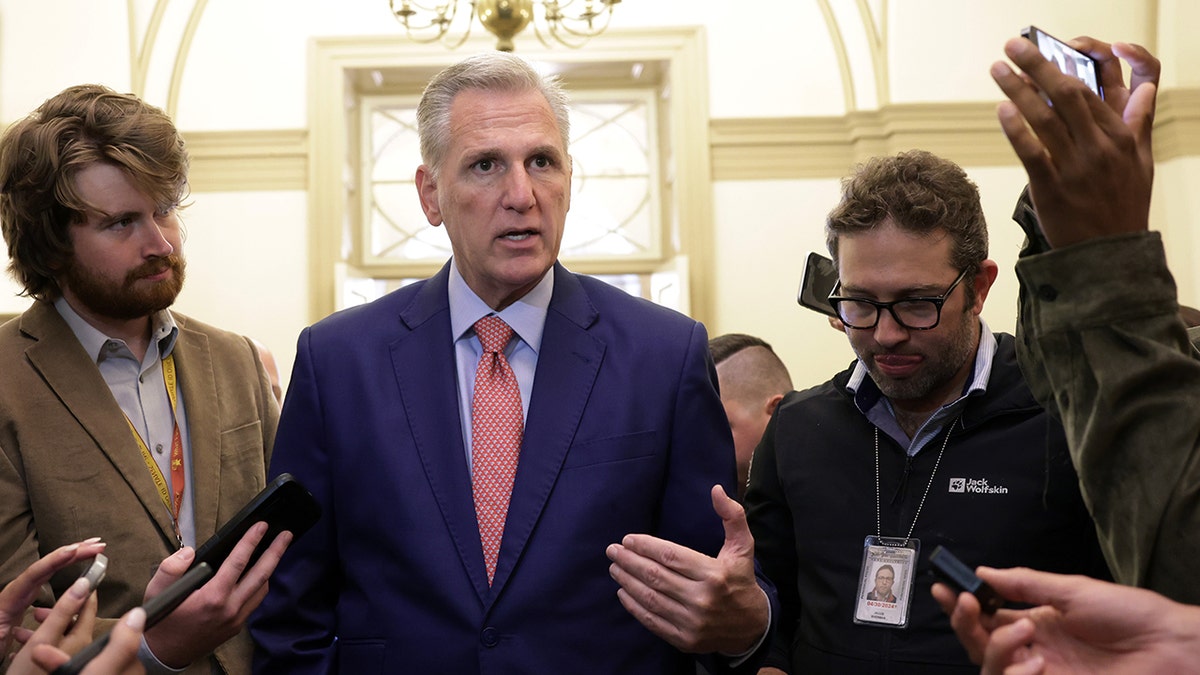 McCarthy speaking with reporters