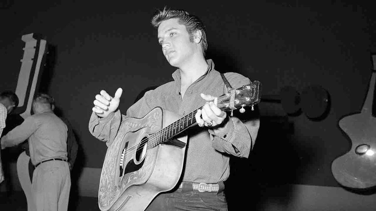 Elvis Presley playing guitar