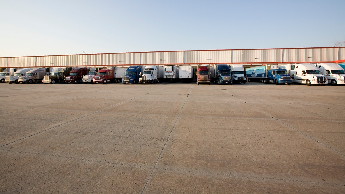 Trucks lined up outside warehouse