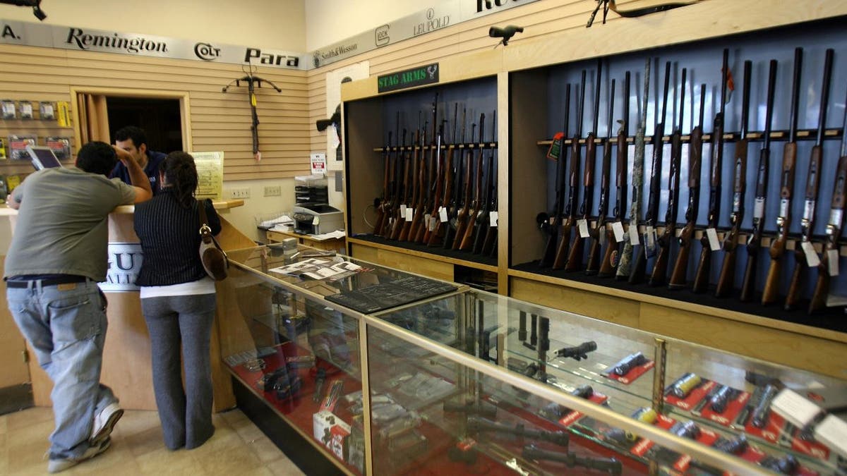 Couple standing in California gun store
