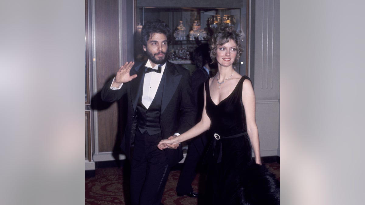 Chris Sarandon holding hands with Susan Sarandon