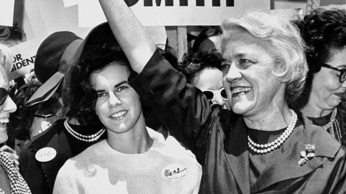 Margaret Chase Smith in front of campaign sign
