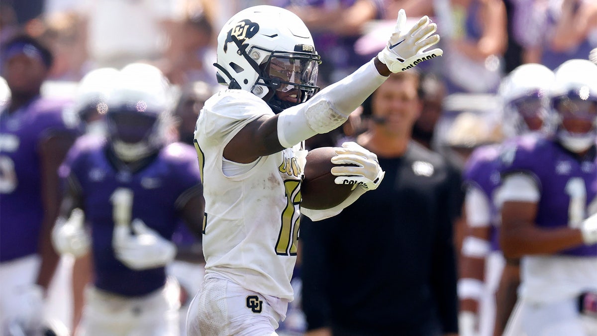 Travis Hunter signals a first down