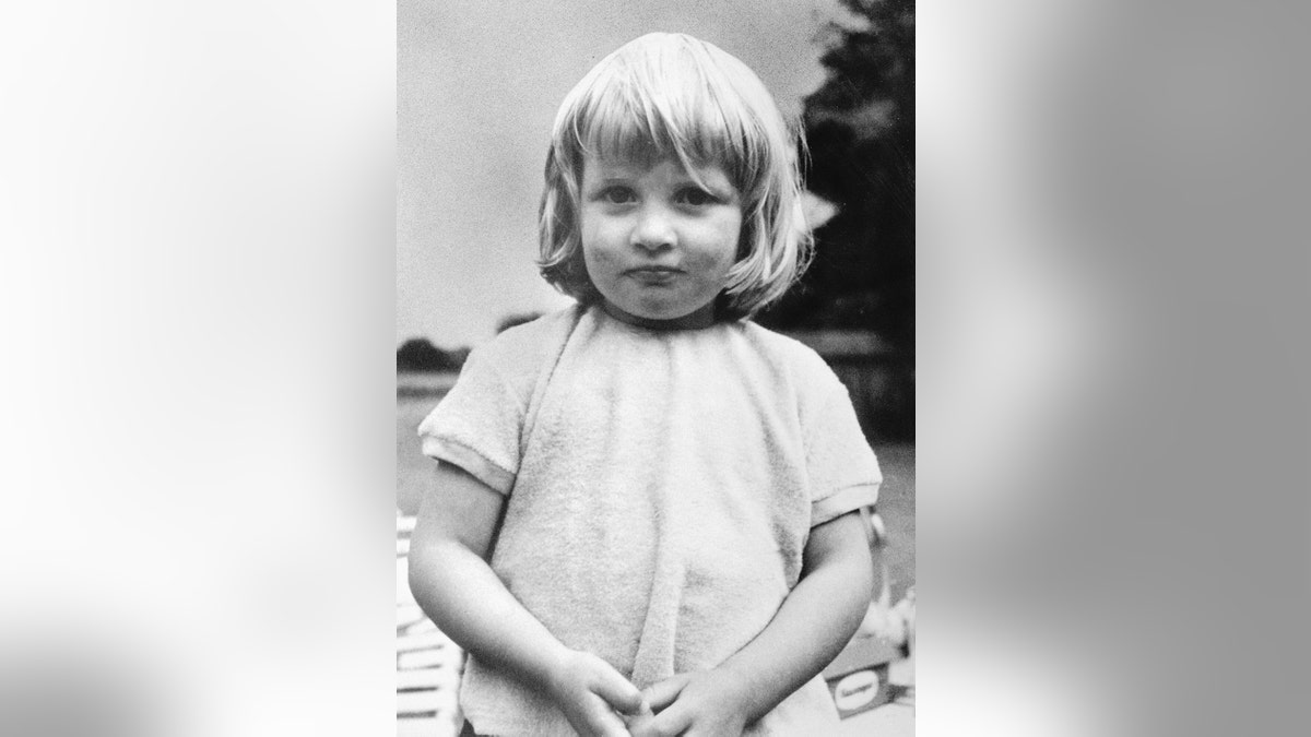 A young Princess Diana wearing white
