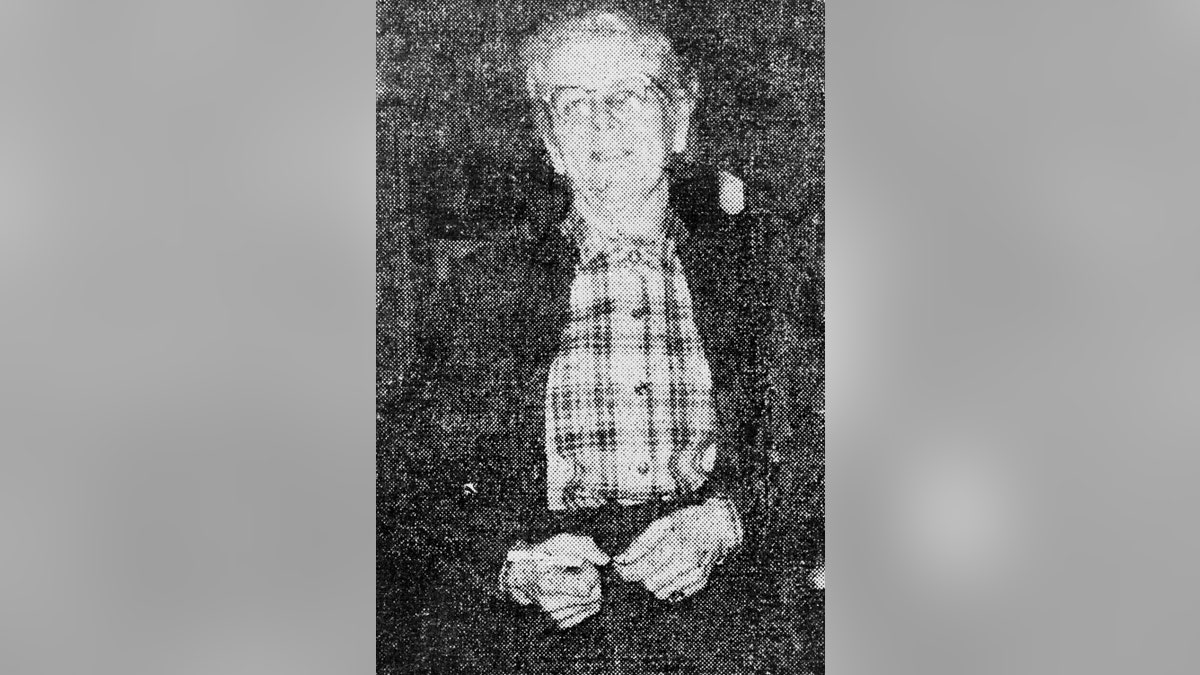 Bernice Worden in a plaid shirt and dark jacket with glasses