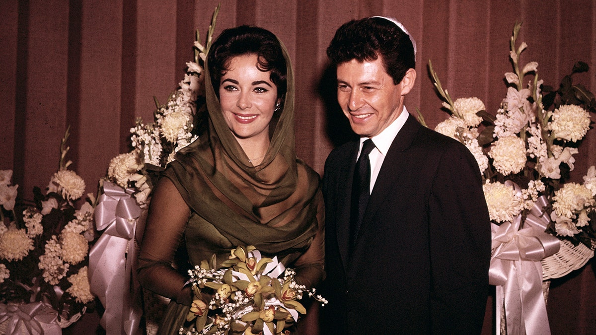 Elizabeth Taylor and Eddie Fisher smiling on their wedding day
