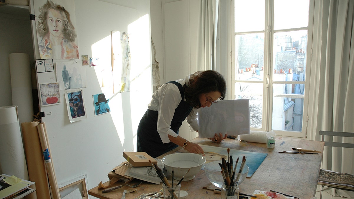 marina Krella in her art studio painting