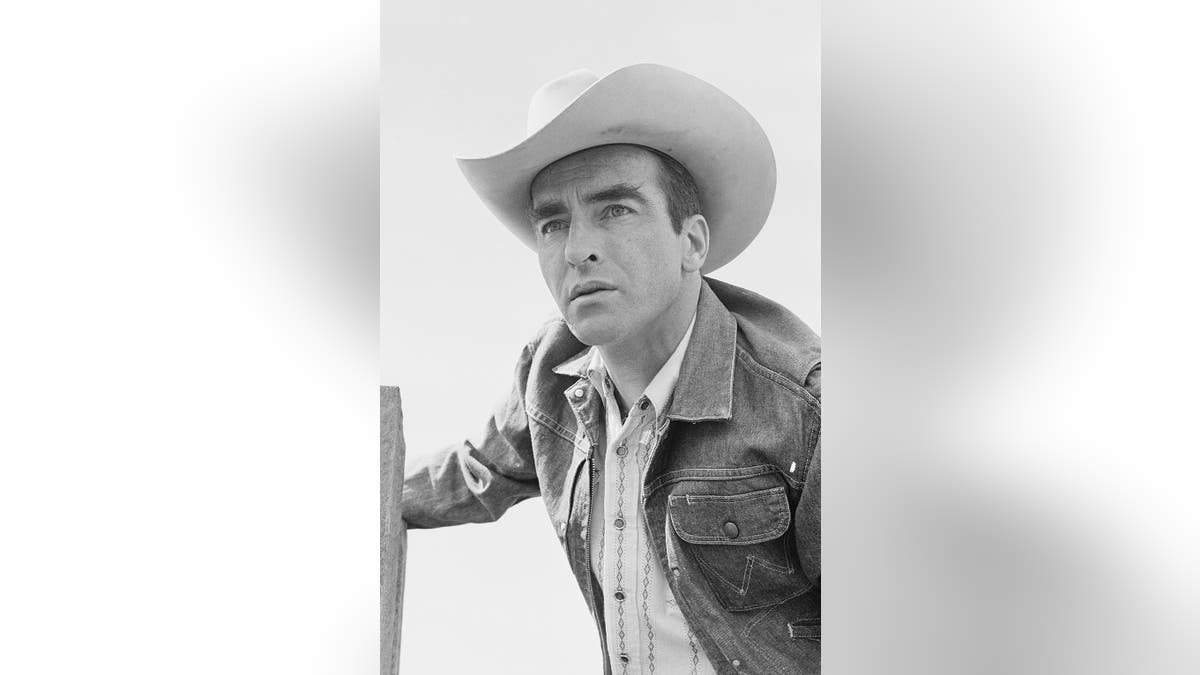 A close-up of Montgomery Clift wearing cowboy gear