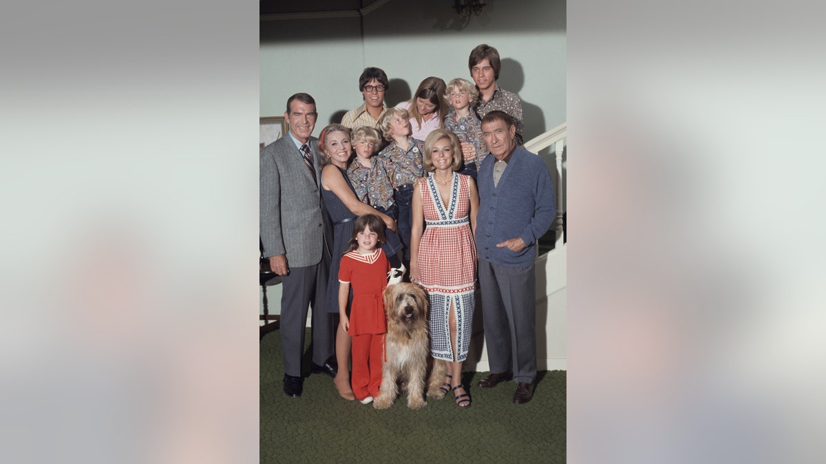 The cast of My Three Sons huddled together for a group photo