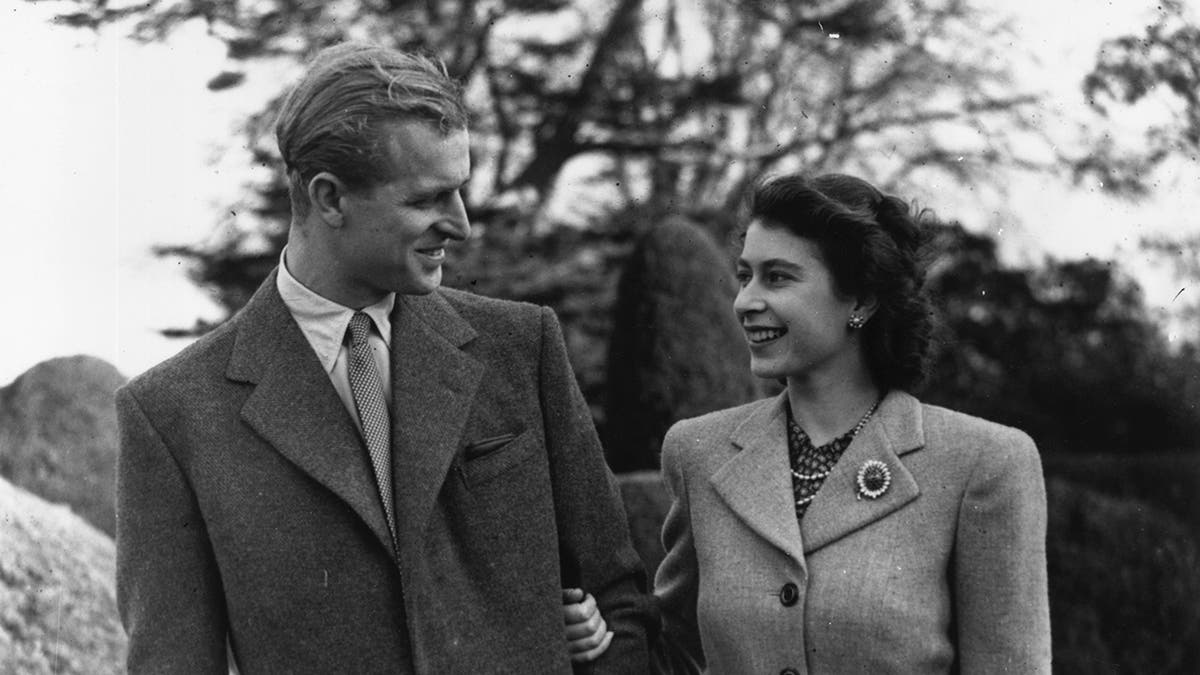 A young Prince Philip and Princess Elizabeth admiring each other
