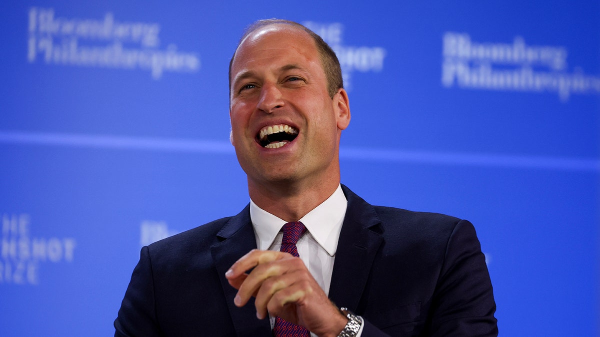 A close-up of Prince William smiling in a suit