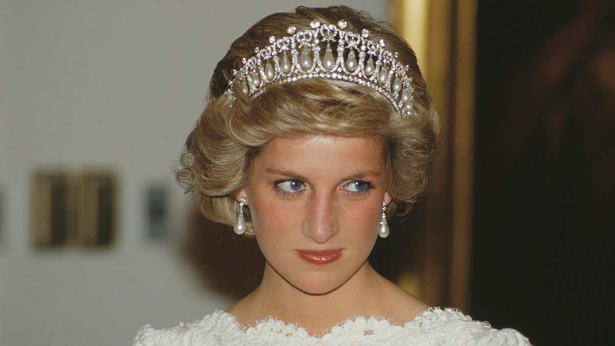 A close-up of Princess Diana wearing a tiara and a white dress