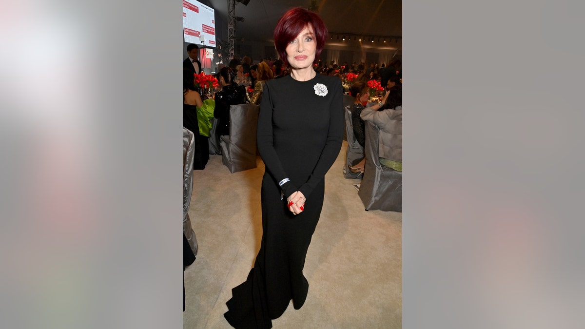 Sharon Osbourne wearing a black long sleeved dress