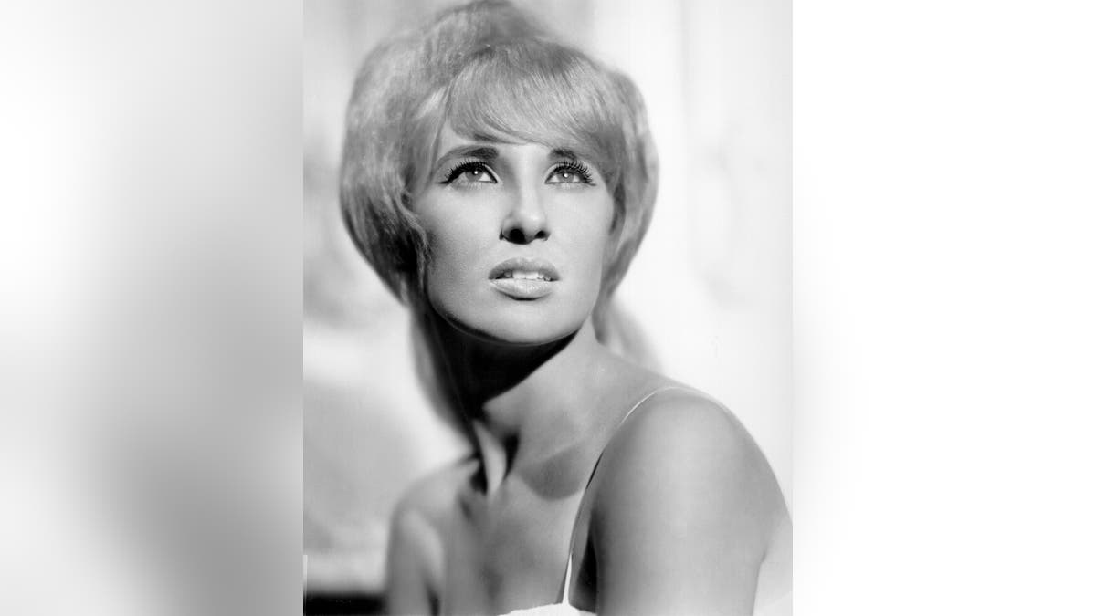 A close-up of Tammy Wynette posing for a glamour shot