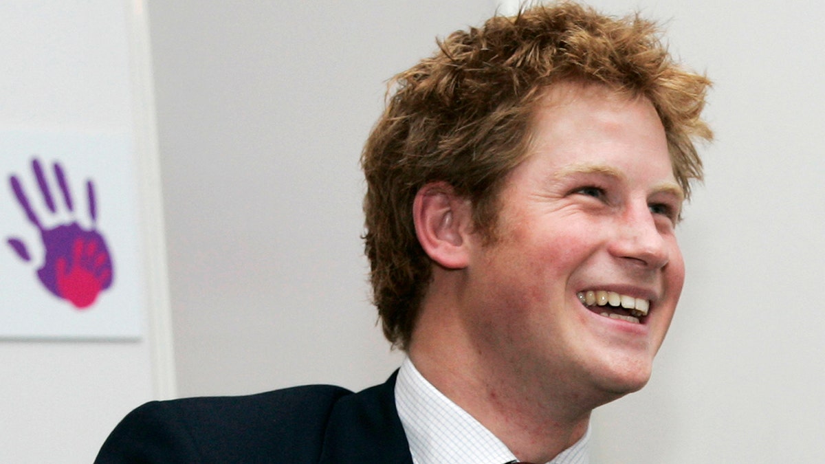 a close-up of a young Prince Harry smiling