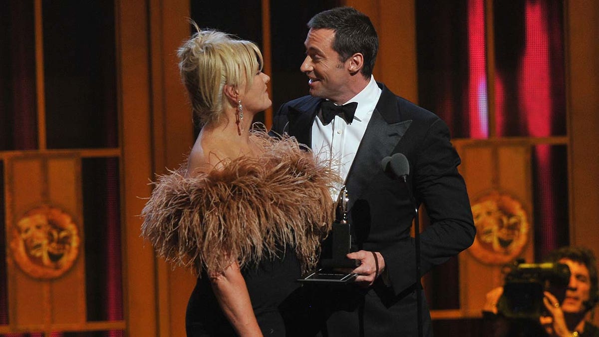 Hugh Jackman and Deborra-Lee Furness pose for a photo.