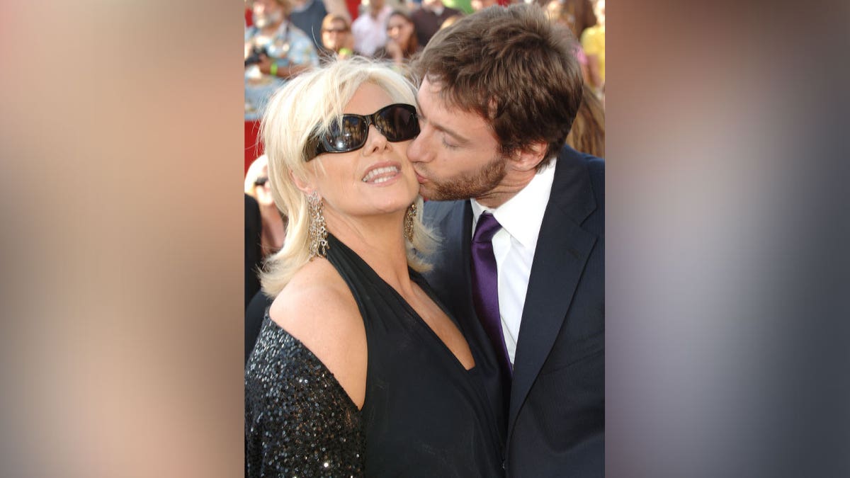 Hugh Jackman and DeBorra-Lee Furness poses for a picture.