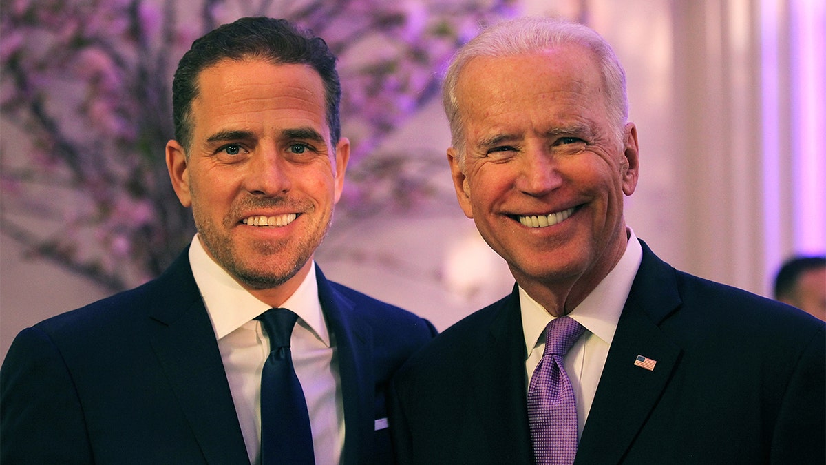 Joe and Hunter Biden smiling into the camera.