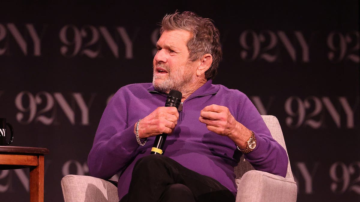 Jann Wenner talking into a mic