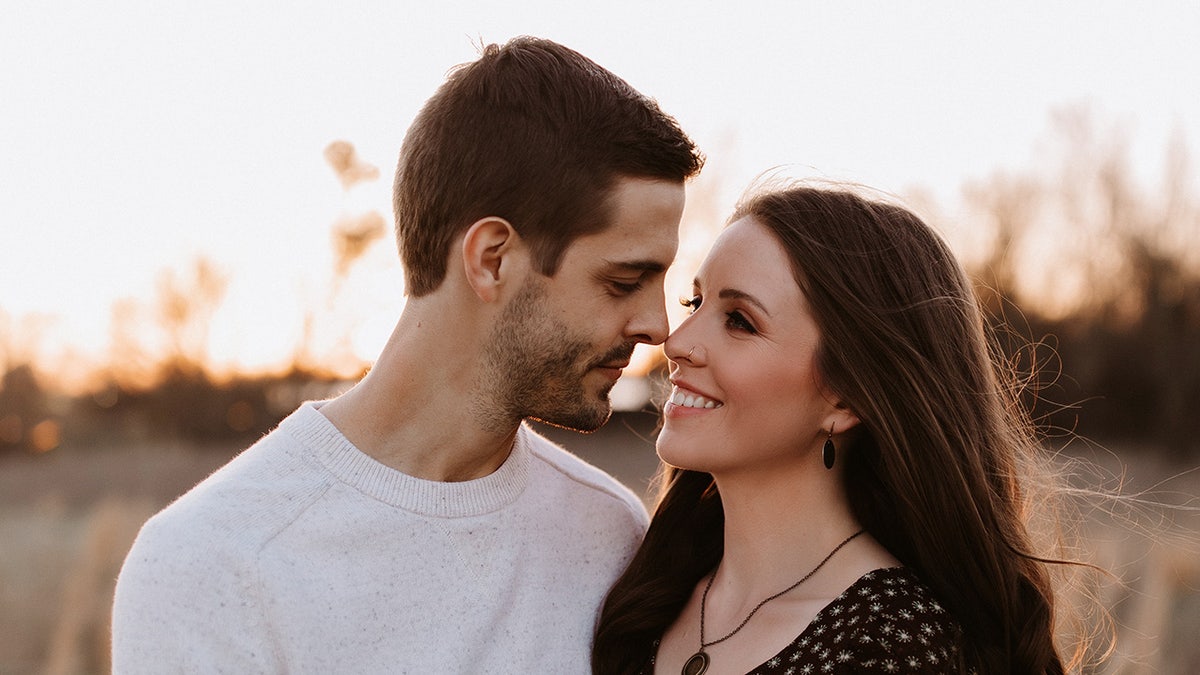 Couple smiling about to kiss