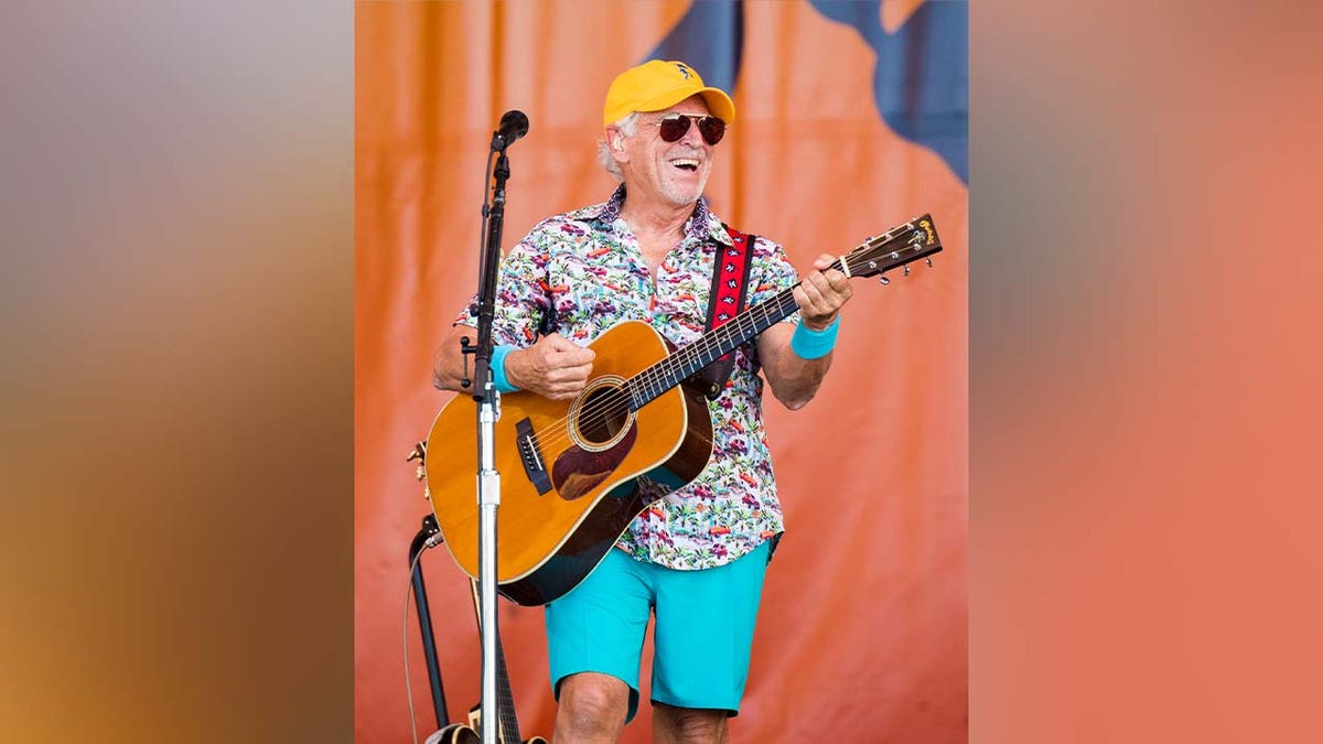 Jimmy Buffett playing guitar