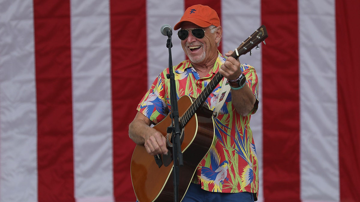 Jimmy Buffett playing guitar