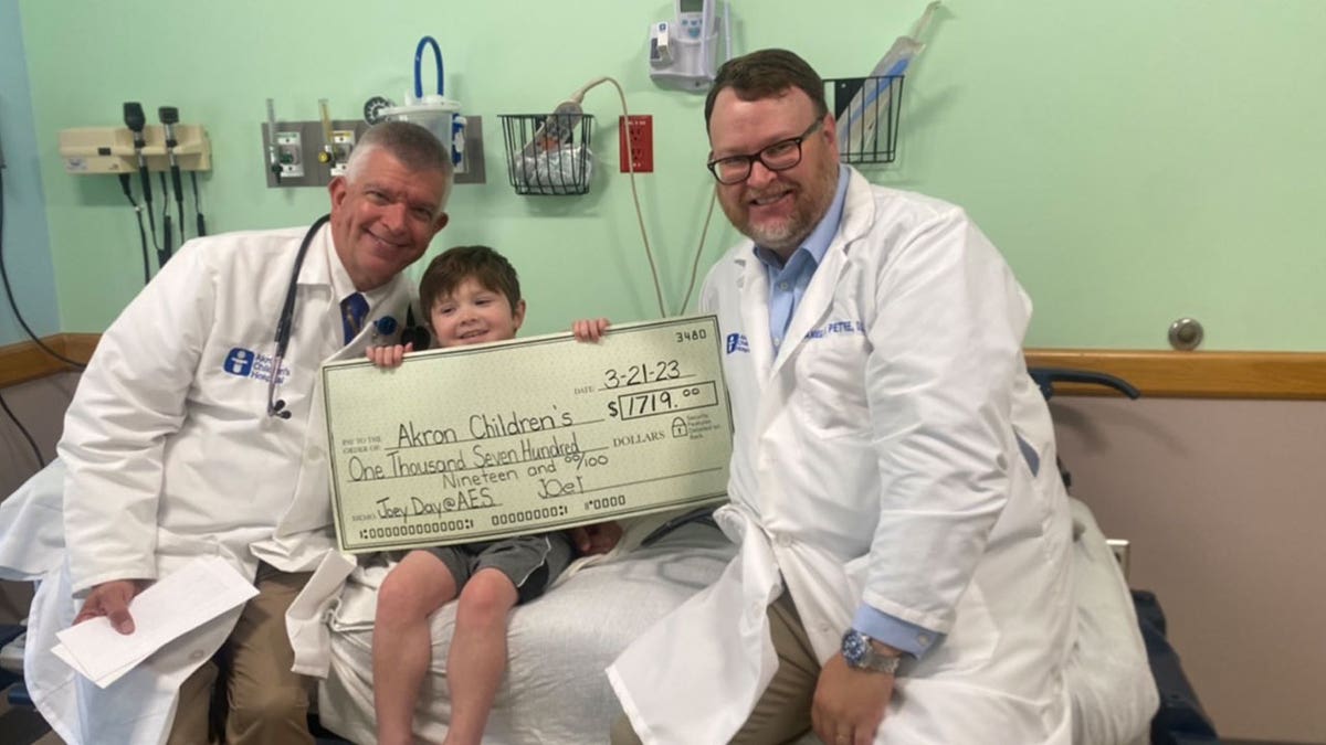 Joey Gaskell, leukemia patient, with doctors