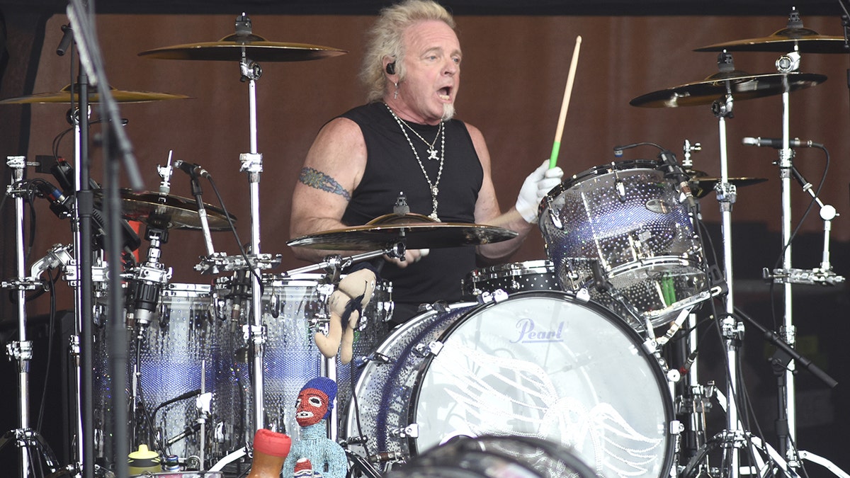 Joey Kramer of Aerosmith drumming on stage