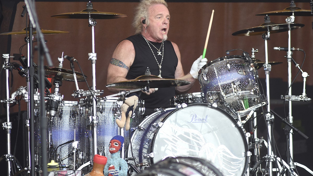 Joey Kramer of Aerosmith drumming on stage