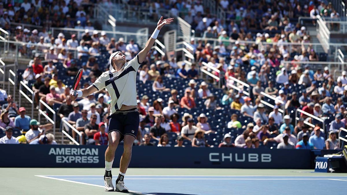 John Isner serves in his final career match