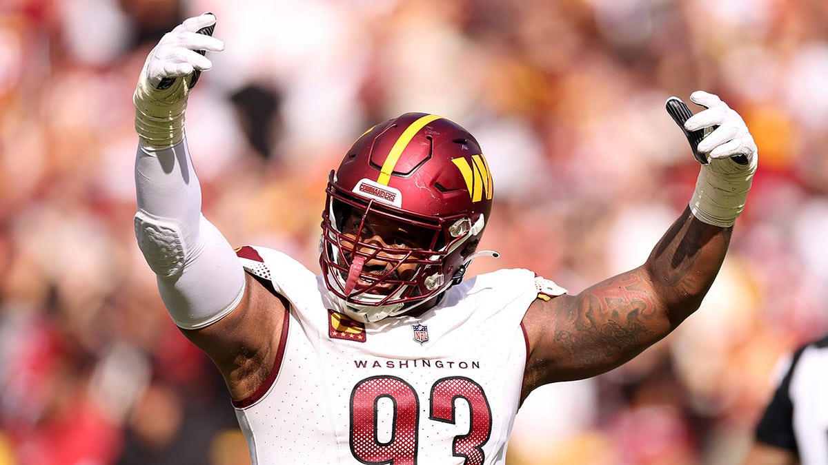 Brian Robinson of the Washington Commanders reacts with teammates News  Photo - Getty Images