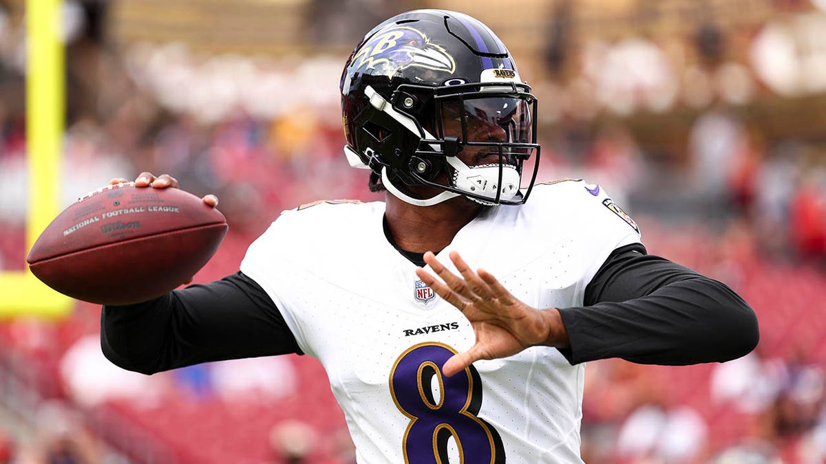 Lamar Jackson throws