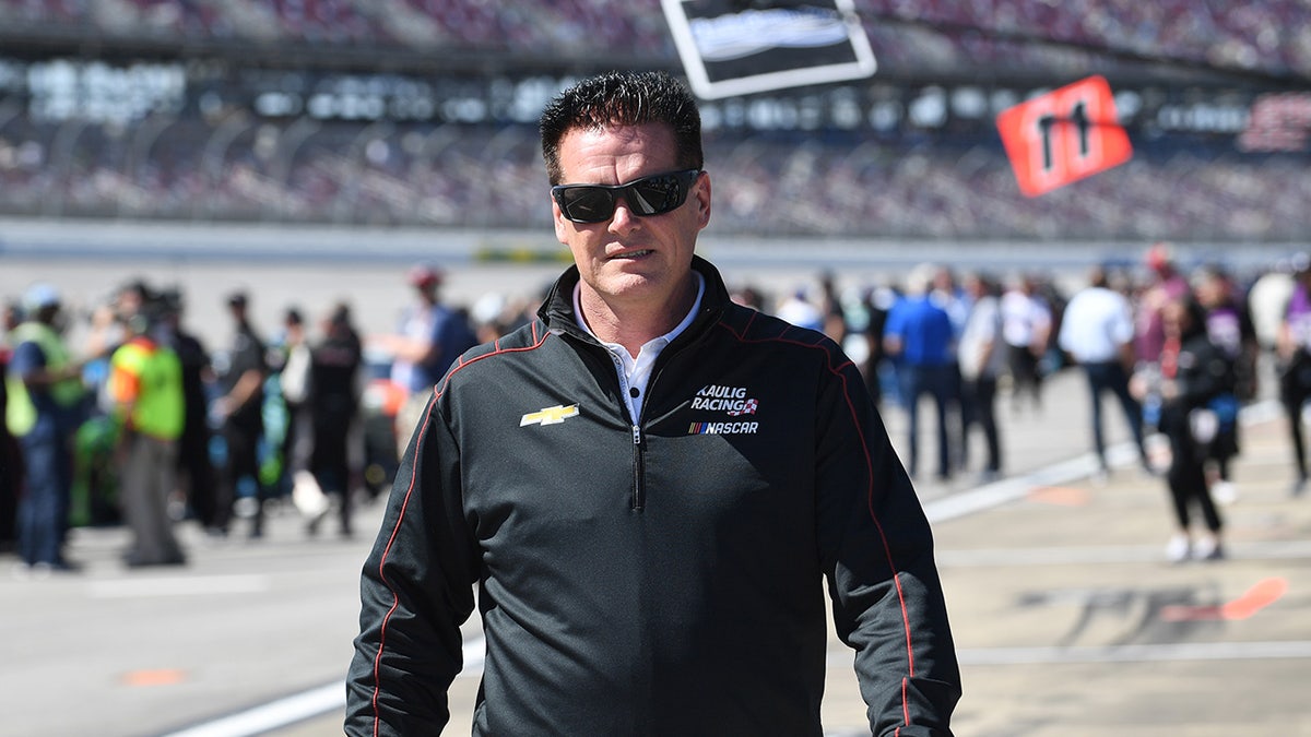 Matt Kaulig walks on racetrack