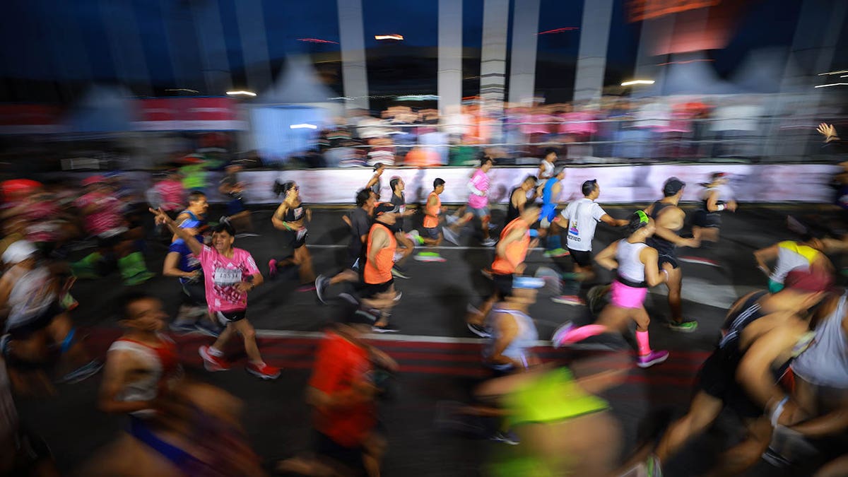 Mexico City Marathon runners at night