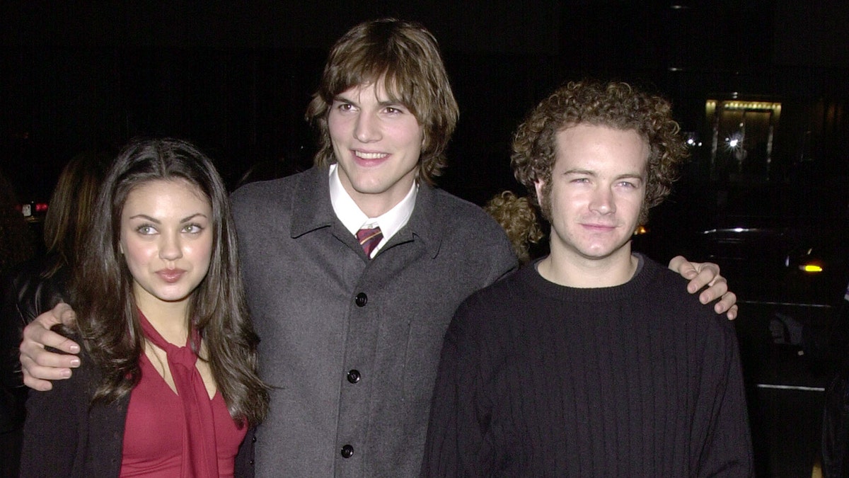 Mila Kunis, Ashton Kutcher and Danny Masterson attend a premiere