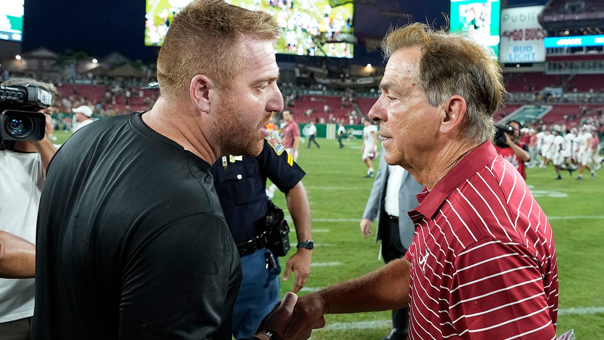 Nick Saban and Alex Golesh