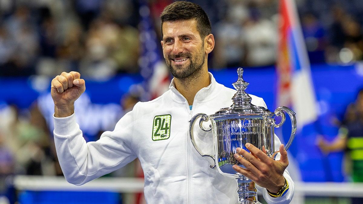 Novak Djokovic holds the trophy