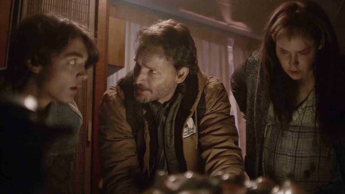 Asher Angel, Peter Facinelli, and Fiona Dourif in a scene from On Fire