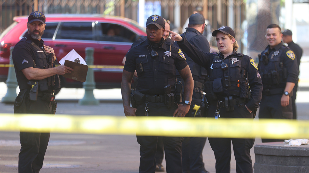 Oakland police stand behind yellow caution tape